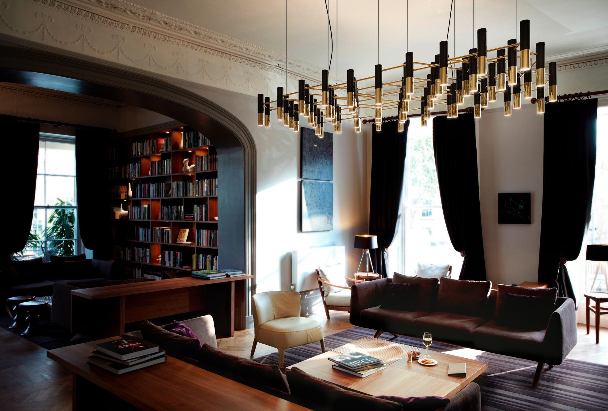Goldene Hängeleuchte im Wohnzimmer #couchtisch #sessel #sofa #schwarzehängeleuchte ©Delightfull