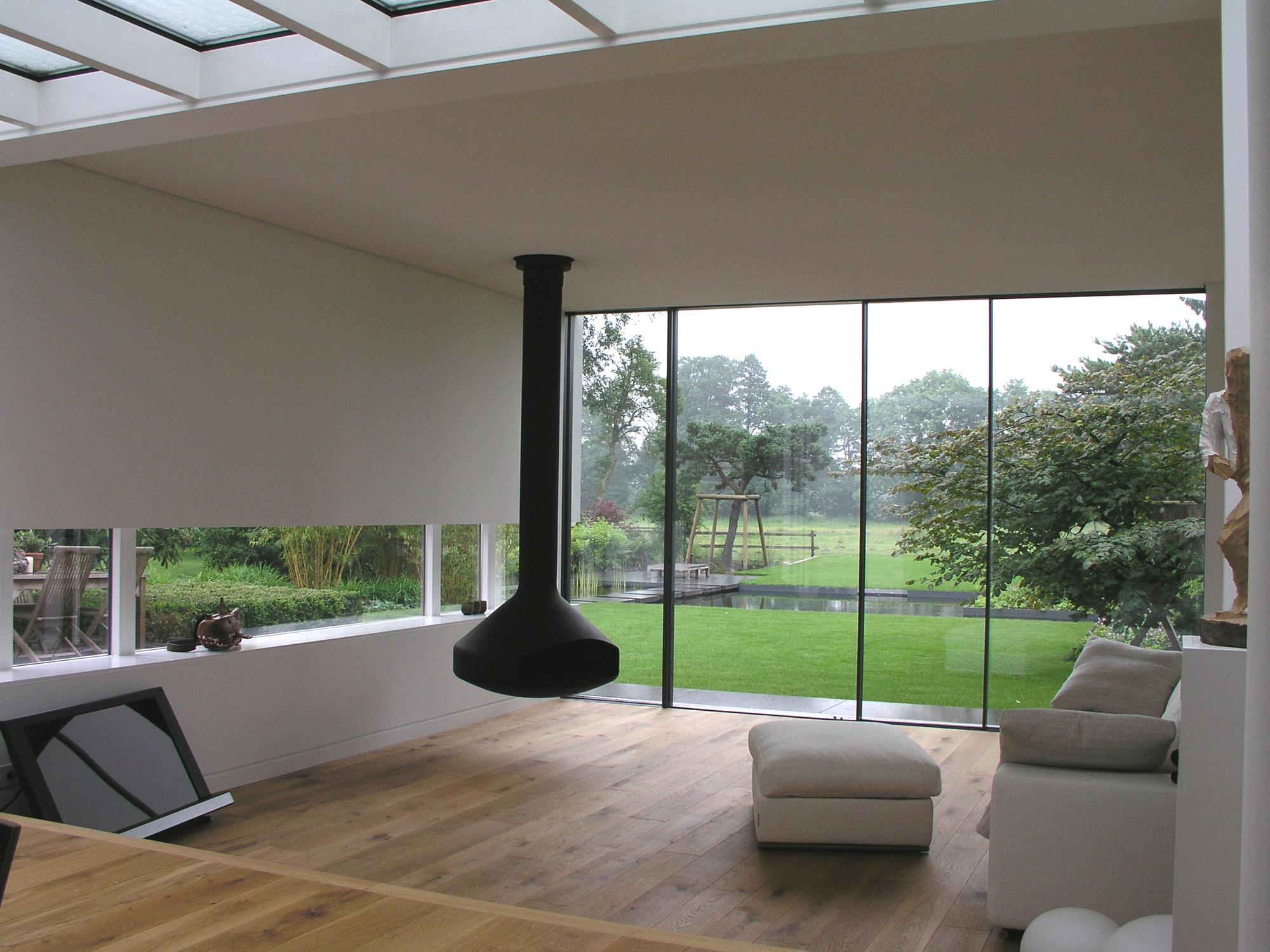 Wohnzimmer mit optimalem Gartenblick #kamin ©Frank Püffel